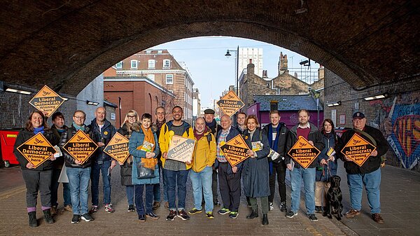 Lib Dem activists campaigning in Waterloo under the railway arches.