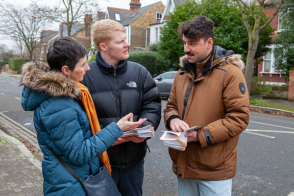 Lib Dem activist Fareed Alderechi and Lib Dem councillor Ben Curtis campaign with London Assembly Member Caroline Pidgeon